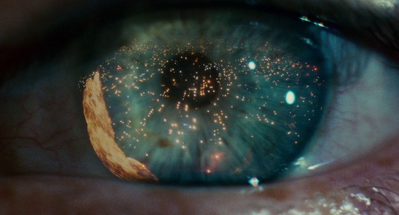 Close-up from Blade Runner (1982) of an eye with the 'Hades Landscape' reflected in the iris