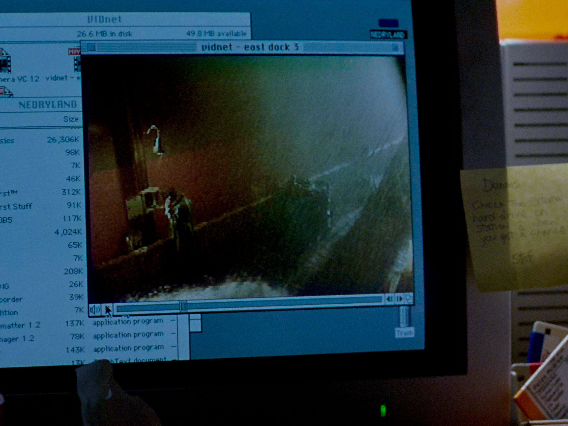Image from Jurassic Park (1993) of Dennis Nedry's desktop showing that his hard drive is named NEDRYLAND